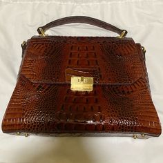 This Is The It Bag! Beautiful Pecan Color, Gorgeous Classic Design And Clasp. Brand New And Never Been Used! Includes Original Price Tag, Strap, And Dust Bag. Perfect For The Fall Season! Classic Brown Bag With Crocodile Pattern, Classic Brown Crocodile Pattern Shoulder Bag, Luxury Brown Crocodile Pattern Bag, Luxury Brown Crossbody Satchel, Elegant Brown Bag With Crocodile Pattern, Elegant Brown Crocodile Pattern Shoulder Bag, Elegant Brown Crocodile Pattern Bag, Brown Crocodile Pattern Crossbody Satchel, Luxury Brown Shoulder Bag With Crocodile Pattern