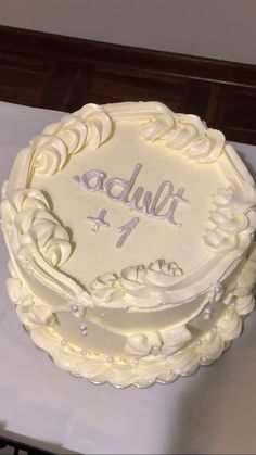 a white cake with the word adult on it