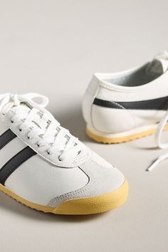 Ready...set...GOLA! Born and bred in England, the best-in-game brand leads with vintage designs and timeless flair. This sleek, low-profile sneaker features a gum sole with an integrated bumper, a short toe vamp, and an unlined soft leather upper, staying true to its original design for a standout look. | Race Sneakers by Gola in White, Women's, Size: 7.5, Leather/Rubber at Anthropologie Retro Custom Sneakers With Gum Sole For Sports, Retro Sneakers For Light Sports With Rubber Sole, Retro Sneakers With Rubber Sole For Light Sports, Vintage Low-top Custom Sneakers With Gum Sole, Retro Low-top Custom Sneakers With Gum Sole, Retro Low-top Custom Sneakers With Rubber Sole, Vintage Low-top Sneakers With Rubber Heel Cap, Retro Lace-up Sneakers With Rubber Heel Cap, Gola Sneakers