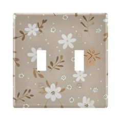 a light switch cover with flowers on it