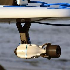 a close up view of a surfboard with some blue and white objects attached to it