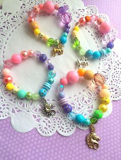 Pastel Unicorn bracelet, rainbow jewelry, MISMATCHED rainbow bracelet. kids jewellery, kids birthday party, rainbow party. SET of TEN. Party planning is already so stressful. Leave the favors up to us! PLEASE NOTE: these bracelets are mismatched, and not all 10 bracelets will be identical. Here is how it works. This listing is for a set of 10 stretchy kids bracelets. If you need more or less, please convo us and we will be more than happy to make you a custom listing. You may also check our face Gracie Animal, Homemade Beads, Kids Jewelry Diy, Birthday Party Rainbow, Kids Bead Bracelet, Pastel Accessories, Kids Jewellery, Unicorn Bracelet, Angel Bracelet