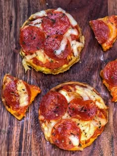 mini pizzas with pepperoni and cheese on a wooden table