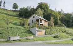 a small house on the side of a hill