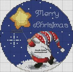 a cross stitch christmas ornament with a santa clause on it's back