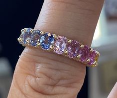 Gorgeous rainbow sapphire eternity ring yellow gold. Excellent craftsmanship, all stones set nice and smooth. Check out the side detail pave diamonds all around; it's so beautiful. These are all natural real sapphires of fancy colors. Almost 5mm band. Sapphires are a durable gem for everyday wear. One only! No reorder Genuine earth mined fancy color sapphires 19 pieces Total weight: 6.63 carats Eye clean stone May be standard heat treated. Genuine earth mined round brilliant cut diamonds total w Rainbow Diamond Ring, Rainbow Sapphire Ring, Rainbow Diamond, Sapphire Eternity Band, Ruby Anniversary, Sapphire Eternity Ring, Rainbow Ring, Gold Stock, Sapphire Wedding Band