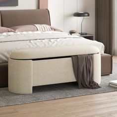 a bedroom with a bed, nightstand and rug