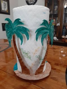 a paper towel holder with palm trees on it