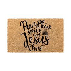 a door mat with the words pumpkin spice and jesus christ written in black on it