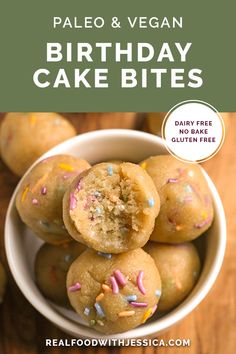 a white bowl filled with cake bites covered in sprinkles on top of a wooden table