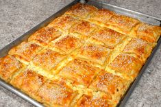 a baking pan filled with bread on top of a counter