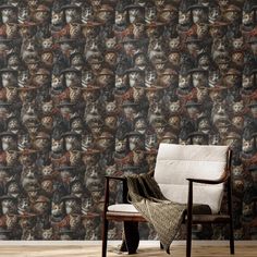 a chair sitting in front of a wall with monkeys on it's face pattern