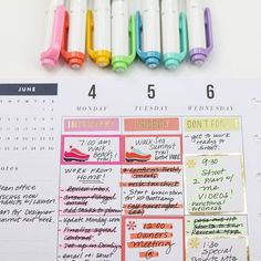 a calendar with colorful markers on it