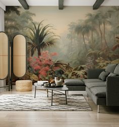 a living room with a large painting on the wall next to a couch and coffee table