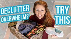 a woman holding a basket full of clothes with the words declutter overwhelm?