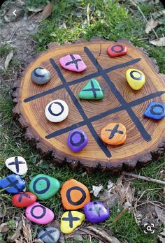 a tic - tac - toe board sitting in the grass