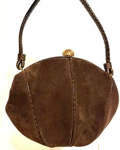 "This a beautiful, timeless vintage brown suede bag.  Balloon shape, very nice soft suede.  Patterned leather design as well as frame and handle.  The claps is gold metal.  the inside is lined with brown fabric.  There are two pockets.  It includes a mirror labeled Bergdorf Goodman as well as coin little purse.  The lining is in excellent condition.  There is faint Cobletz mark.  This is very beautiful bag in great condition.   Measurements Height - 12\" Width - 10 1/2\" Happy to answer any questions or provide additional pics Please note that my store doesn't accept returns and doesn't ship internationally" Brown Suede Evening Bag, Formal Suede Bags With Detachable Handle, Formal Suede Shoulder Bag With Detachable Handle, Vintage Brown Leather Shoulder Bag For Evening, Evening Suede Shoulder Bag With Detachable Handle, Formal Suede Bags, Brown Leather Evening Bag, Vintage Brown Suede Bags, Brown Evening Bag With Handles