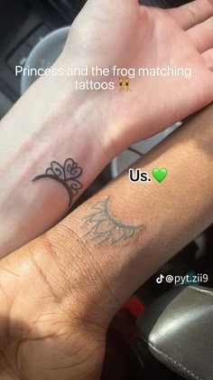 two people with matching tattoos on their arms, one is holding the other's hand