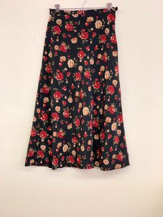 Vintage black floral skirt Approximate Size: 13 W; 33 L Fitted Long Skirt With Floral Print, Black Floral Print Maxi Skirt For Spring, Floral Print Fitted Flared Maxi Skirt, Fitted Floral Print Maxi Skirt, Black Floral Print Skirt, Summer Black Maxi Skirt With Floral Print, Black Floral Print Flowy Skirt, Black Flowy Floral Skirt, Fitted Floral Print Maxi Skirt For Fall