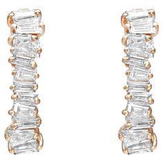 Sparkle all way with these beautiful diamond huggie earrings. Crafted in fine 18K yellow gold. These earrings feature prong set tapered baguette diamonds encrusted halfway through the earring. Total diamond weight: 0.72 carat. Diamond color G-H and clarity VS-SI. Earring size: 0.5 inch. Thickness: 3mm. Weight: 2.31 grams. Secured with a hinged back. Comes with a presentable gift box. Diamond Huggie Earrings, Baguette Diamonds, Baguette Cut Diamond, Huggie Earrings, Baguette Cut, Baguette Diamond, Jewelry Earrings Hoops, Huggies Earrings, Prong Setting