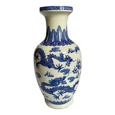 a blue and white vase with dragon designs on the bottom, sitting against a white background