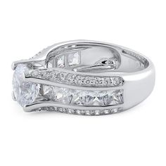 Top of ring height: 8mm

Top of ring width: 8.8mm

Band width: 7.5mm

Shank width: 4.7mm


Stone material: clear cubic zirconia

Center stone size: 8mm

Stone shape: round & princess cut

Center stone carat weight: 2.04 ct.

Total number of CZ stones: 51

Stone setting: prong setting


Metal: 925 sterling silver

Plating: rhodium plated

Finish: high polish Rainbow Topaz, Princess Cut Engagement, Princess Cut Engagement Rings, Stone Material, Ring Pictures, Engagement Ring Cuts, Large Ring, Stone Setting, Cz Ring