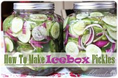 two mason jars filled with pickles and onions