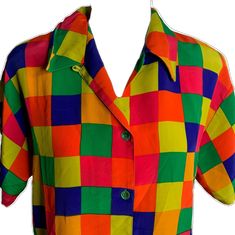 Multicolor Short Sleeve Blouse With Patchwork, Multicolor Patchwork Short Sleeve Blouse, Summer Multicolor Blouse With Buttons, Fitted Multicolor Color Block Shirt, Multicolor Button-up Blouse With Button Closure, Multicolor Summer Blouse With Button Closure, Fitted Multicolor Shirt With Color Block, Spring Multicolor Color Block Shirt, Multicolor Collared Shirt With Colorful Pattern