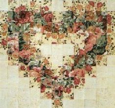 a piece of art that looks like a heart made out of flowers on a white background