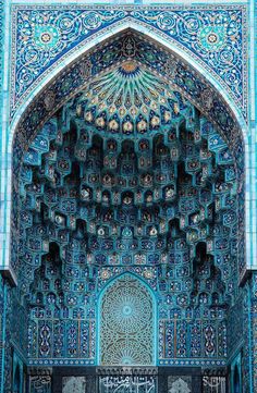 the inside of a blue and white building with intricate carvings on it's walls