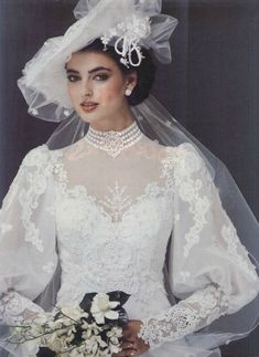 a woman in a wedding dress and veil