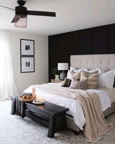 a bedroom with a large bed and white carpet