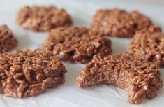 several cookies are arranged in the shape of a star on top of white parchment paper