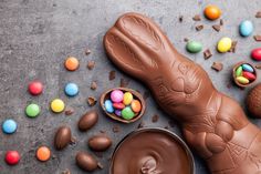 an assortment of chocolate candies and candy on a table