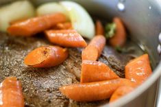 carrots and celery being cooked in a pot