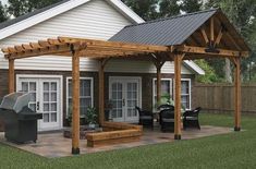 a backyard with a grill and covered patio