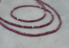 Micro faceted super tiny garnet necklace Made of 14k solid yellow gold clasp and 6 gold beads with 1.8mm red garnet faceted beads. This dainty and minimalist necklace is great alone or stacked with other necklaces Please select your prefered clasp: fish lock or spring ring *Matching bracelet in my shop! Measures: Garnet beads- 1.8mm approx Length- please select in the drop down menu Garnet Jewelry With Faceted Round Beads, Faceted Garnet Round Bead Jewelry, Elegant Garnet Necklace With Faceted Beads, Elegant Burgundy Jewelry With Faceted Beads, Gold Chocker Necklace, January Birthstone Necklace, Dangle Earrings Wedding, Pearl Earrings Wedding, Garnet And Gold