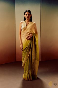 "\nLotus\n\nDelicately blooming lotuses are skilfully realized on fluid bodies of handwoven georgette in a celebration of heritage, art and nature. Bandhani\u2019s precision and intricate Banarasi zari detailing is masterfully employed to bring to life the organic motifs that adorn this handwoven and mastercrafted drape.\n\n\nColor - A beautiful ombre of Light Green and Peach\n\nFabric\u00a0- Pure Khaddi\u00a0Georgette\n\nTechnique - The saree is a complex realization of an intensive process completed over months, embodying thoughtful design and the cultural richness that defines Banarasi handloom and Kutchi Bandhani artisanship. Handwoven in Banaras with kadhua weave borders and subsequently patterned through the traditional resist-dyeing technique of Kutchi Bandhani. The process of resis Heritage Art, Resist Dyeing, Haldi Outfit, India Inspired, Art And Nature, Bandhani Saree, Dyeing Techniques, Handloom Saree, Cotton Saree