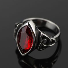 Description  Here we have an Edwardian reproduction ring in Stainless Steel filigree with a perfect Simulated/Man-made Red Ruby gemstone solitaire.   Detail   Handmade item  Materials: 316L Stainless Steel  Gem Color: Red  Band Color: Silver  Ring Width: 19.3mm  Style: Celtic Knot Gemstone Ring For Men, Rubin Ring, Nordic Vikings, Ring Man, Viking Symbols, Norse Vikings, Red Band, Viking Jewelry, Creating Jewelry