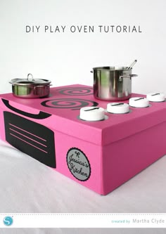 a pink box with pots and pans on it