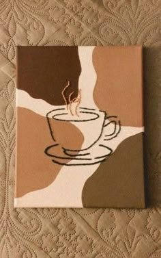 a painting of a coffee cup on top of a table