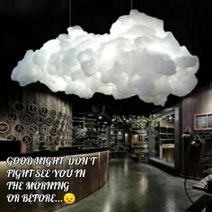 a large cloud hanging from the ceiling over a restaurant