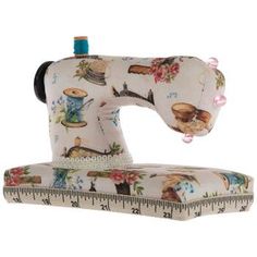 a sewing machine sitting on top of a ruler