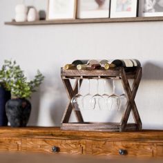 a wooden shelf with wine glasses on it