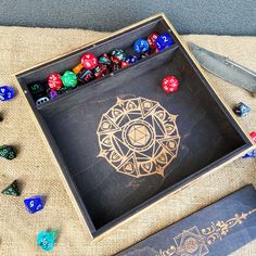 the dice tray is filled with different colored dices