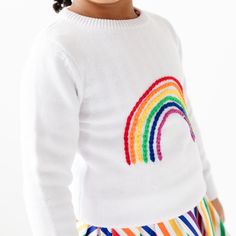 Rainbow Pullover Sweater Available in sizes: 2/3y, 4/5y, 6/7y, 8y & 10y. 100% cotton sweater Gathered hem at end of sleeves and bottom for comfort fit Sweaters run closer to the smaller size of each size. For example, a 6/7 sweater is closer to a size 6 than a size 7. 100% Cotton. Hand wash. Hang to dry. Imported. Cute Long Sleeve Sweater For Playwear, Long Sleeve Sweater For Winter Playwear, Fall Playwear Long Sleeve Sweater, Long Sleeve Sweater For Playwear In Fall, Playful White Knit Top, White Knit Playful Tops, Fall Long Sleeve Playwear Sweater, White Playful Knit Top, Playful Cotton Crew Neck Sweater