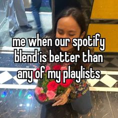 a woman sitting on the ground with flowers in her hand and texting me when our spotty blend is better than any of my playlists