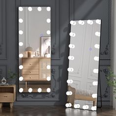 a large mirror with lights on it next to a dresser