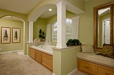 a large bathroom with a jacuzzi tub in it