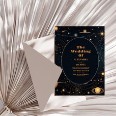 a black and gold wedding card with the words, the wedding of aleyna & michael